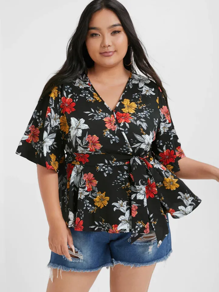 BLOOMCHIC WRAP STYLE BELTED V NECK WITH FLORAL DESIGN ON SOLID COLOR BACKGROUND