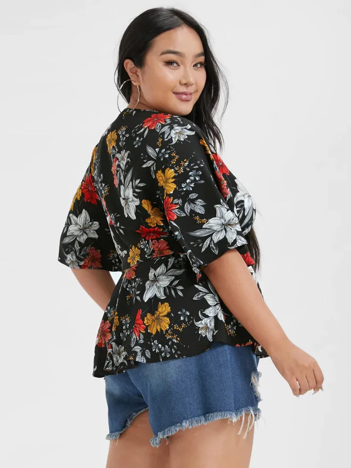 BLOOMCHIC WRAP STYLE BELTED V NECK WITH FLORAL DESIGN ON SOLID COLOR BACKGROUND